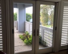 ALABASTER CUSTOM COLOR FRENCH ROLL-AWAYS ON OUTSWINGING DOUBLE DOORS