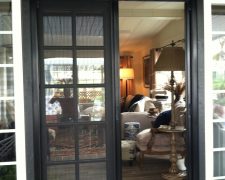 BLACK FRENCH ROLL-AWAY WITH FIXED DOOR ASTRAGAL PINNED IN PLACE