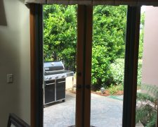 BRONZE FRENCH ROLL-AWAYS ON OUTSWINGING WOODEN DOORS