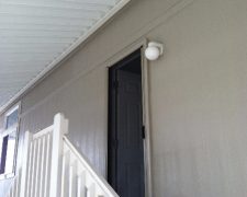 DESERT SAND ROLL-AWAY RETRACTABLE SCREEN DOOR IN USE NEAR STAIRCASE