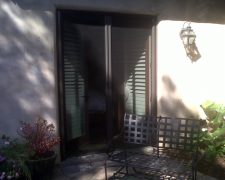 FRENCH BRONZE ROLL-AWAY DISAPPEARING SCREEN DOORS IN USE