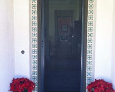 TALL BRONZE ROLL-AWAY RETRACTABLE SCREEN DOOR IN USE