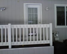 WHITE ROLL-AWAY ON CARPORT DOOR