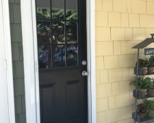 WHITE ROLL-AWAY SCREEN DOOR ON DUTCH DOOR