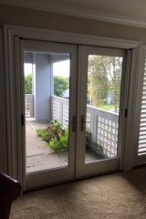 ALABASTER CUSTOM COLOR FRENCH ROLL-AWAYS ON OUTSWINGING DOUBLE DOORS