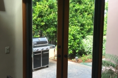 BRONZE FRENCH ROLL-AWAYS ON OUTSWINGING WOODEN DOORS