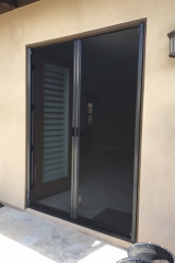 TALL BRONZE FRENCH ROLL-AWAY RETRACTABLE SCREEN DOORS IN USE