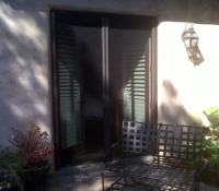 FRENCH BRONZE ROLL-AWAY DISAPPEARING SCREEN DOORS IN USE