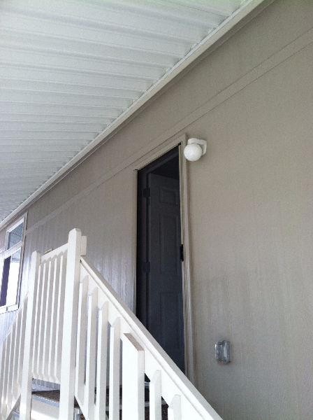 DESERT SAND ROLL-AWAY RETRACTABLE SCREEN DOOR IN USE NEAR STAIRCASE