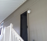 DESERT SAND ROLL-AWAY RETRACTABLE SCREEN DOOR IN USE NEAR STAIRCASE