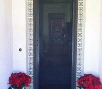 TALL BRONZE ROLL-AWAY RETRACTABLE SCREEN DOOR IN USE