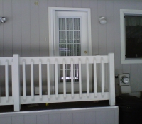 WHITE ROLL-AWAY ON CARPORT DOOR