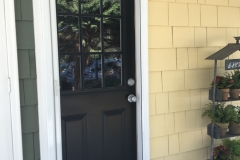 WHITE ROLL-AWAY SCREEN DOOR ON DUTCH DOOR