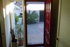 RUBY RED CUSTOM COLOR TRU-VIEW SECURITY SCREEN DOOR LOOKING OUT